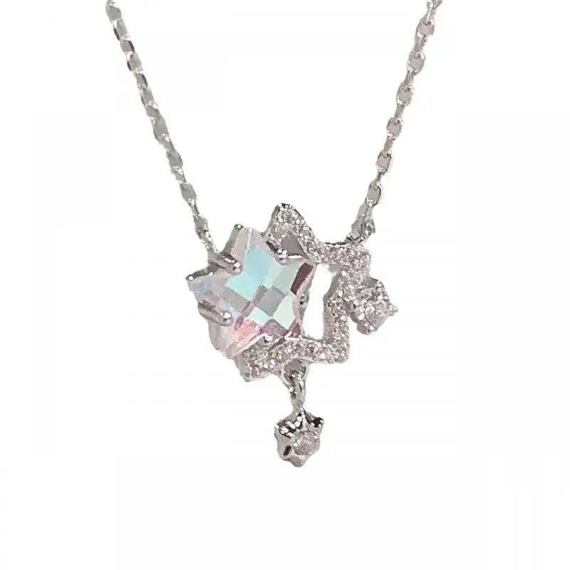 Silver-tone double star pendant necklace with iridescent rhinestones and dangling star charm