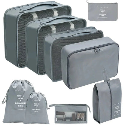Charcoal gray packing cubes set with mesh panels and zippered storage bags for travel.