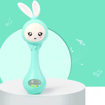 Green rabbit baby rattle toy standing with bunny ears and light window