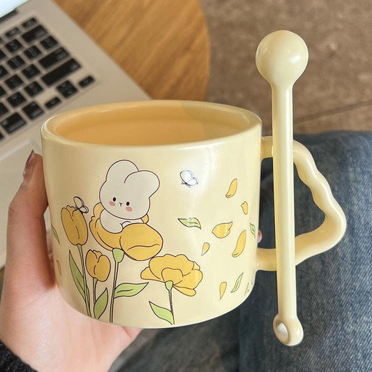 Cream bunny flower mug with illustrated tulips and a matching spoon-shaped handle