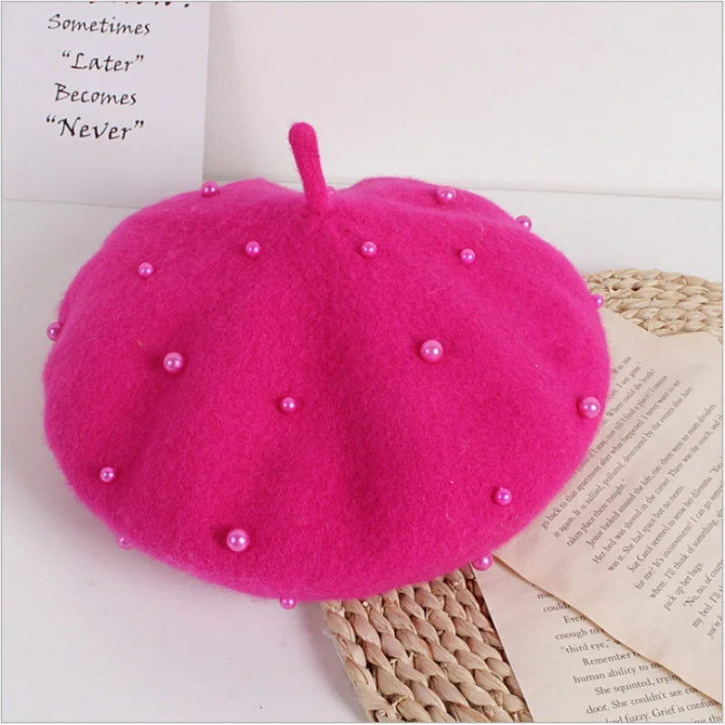 Hot pink felt beret with faux pearl embellishments and a small center stem