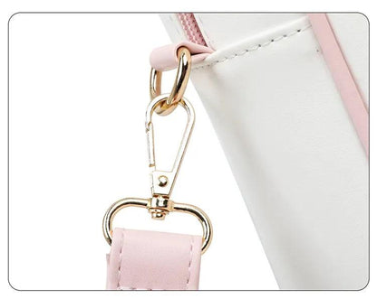 Kawaii messenger bag strap clasp close-up with gold rings and pale pink strap tab