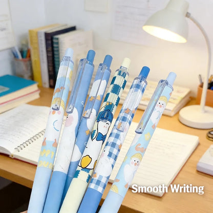 Duck-themed gel pens set with blue caps, clear barrels, cartoon duck artwork on each pen