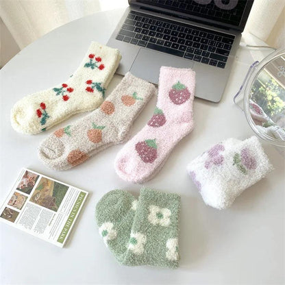 Plush sleeping socks set with cream, pink, and green pairs featuring fruit prints