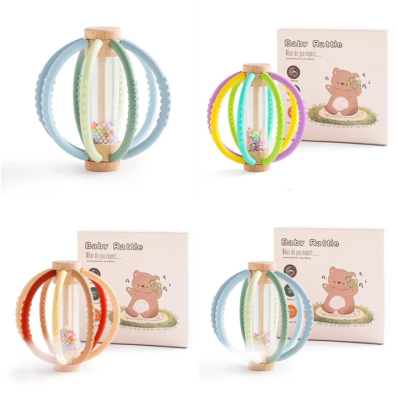 Baby rattle teether toy with light wood handle and pastel silicone ring loops