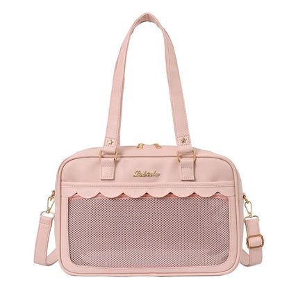 Pink messenger bag with scalloped top edge and mesh front pocket panel