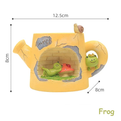 Yellow resin watering can planter with frog garden scene, top view with measurements