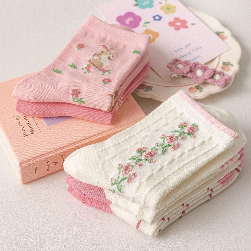 Folded socks set: pink animal print and cream rose print
