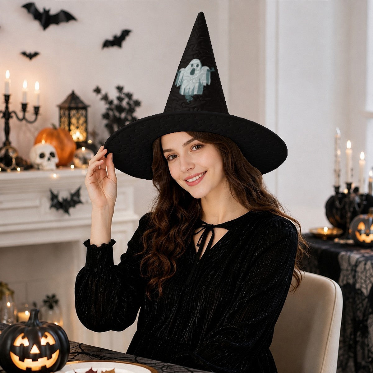 Black witch hat with ghost patch and wide brim, worn by smiling woman