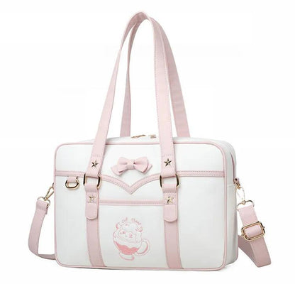 Kawaii messenger bag with white body, pink trim, bow detail, and star accents on front