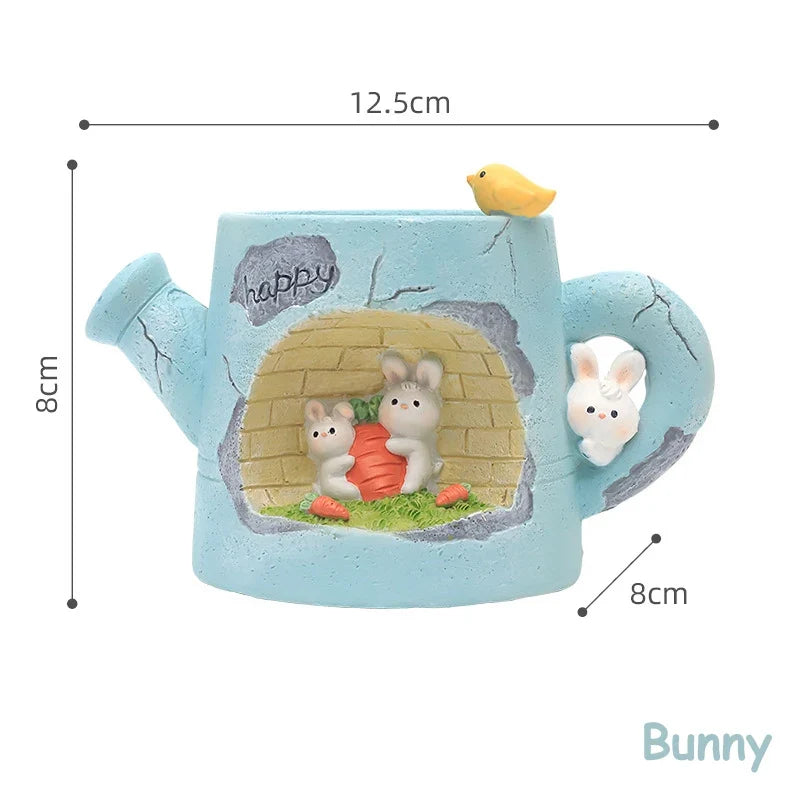 Blue resin watering can planter with bunny garden scene, front view with measurements