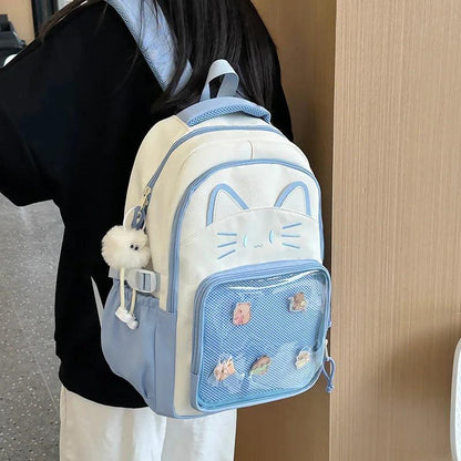 White cat school backpack with blue-trim mesh pocket; shown from side with shoulder straps.