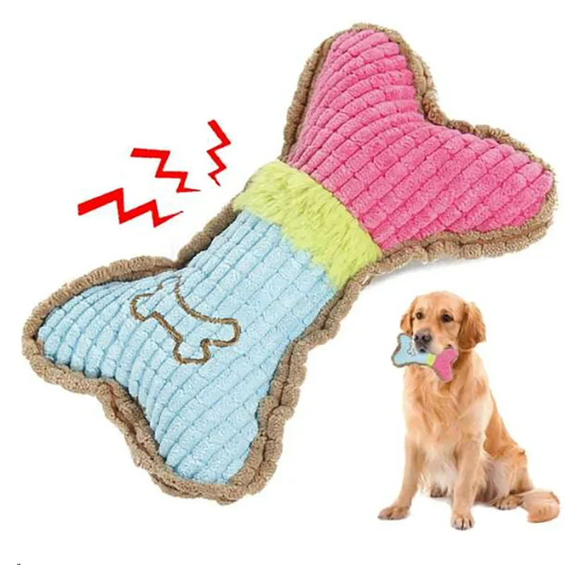 Plush squeaky bone toy, pink and blue with green center stripe, brown trim.