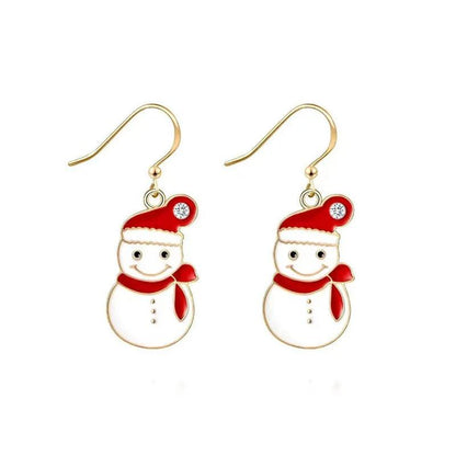 Red heart charm drop earrings with gold hooks, white crystal center, and green tree
