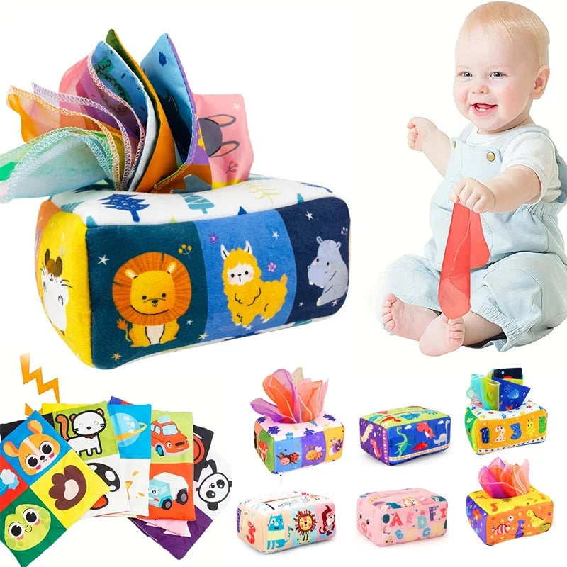 Montessori sensory tissue box toy with colorful fabric roll, animal print, and cloth ribbons