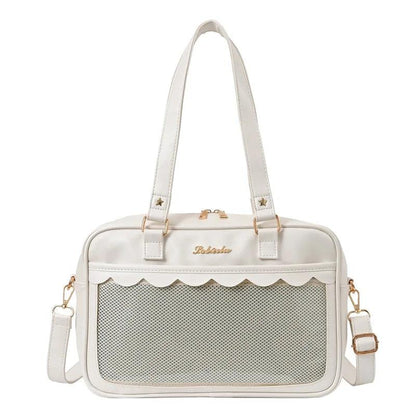 White messenger bag with scalloped top edge and mesh front pocket panel