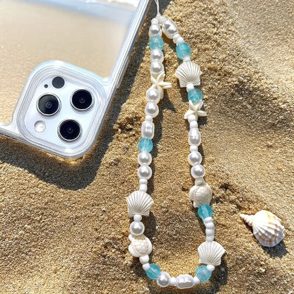 Pearl and blue shell phone charm bracelet with starfish and cowrie bead accents