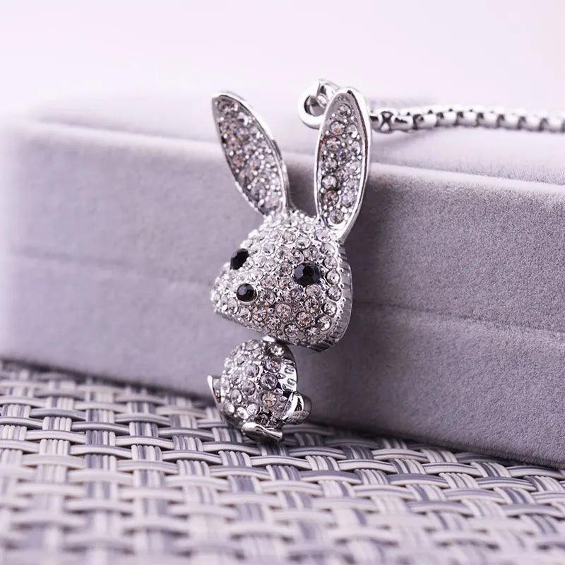 Rhinestone rabbit pendant necklace featuring sparkling ears and black-eyed face