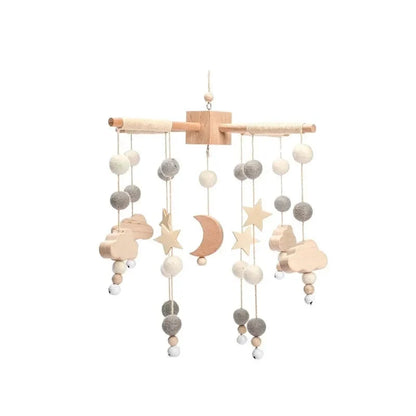 Wooden baby crib mobile with wooden bar and hanging clouds, moons, stars, and beads