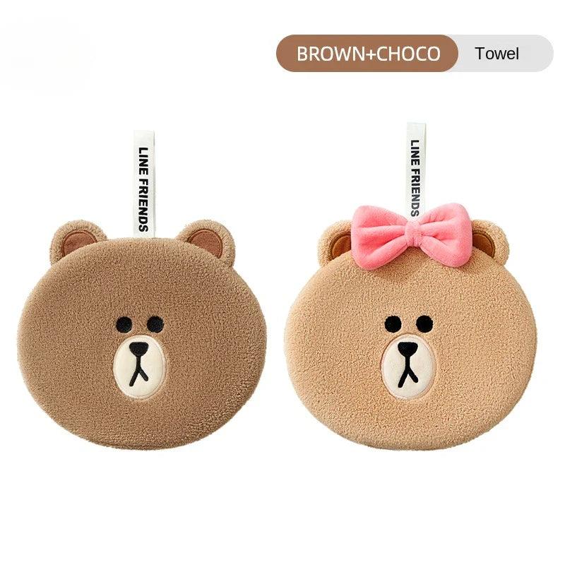 Two teddy bear hand towels: dark and light brown faces with pink bows