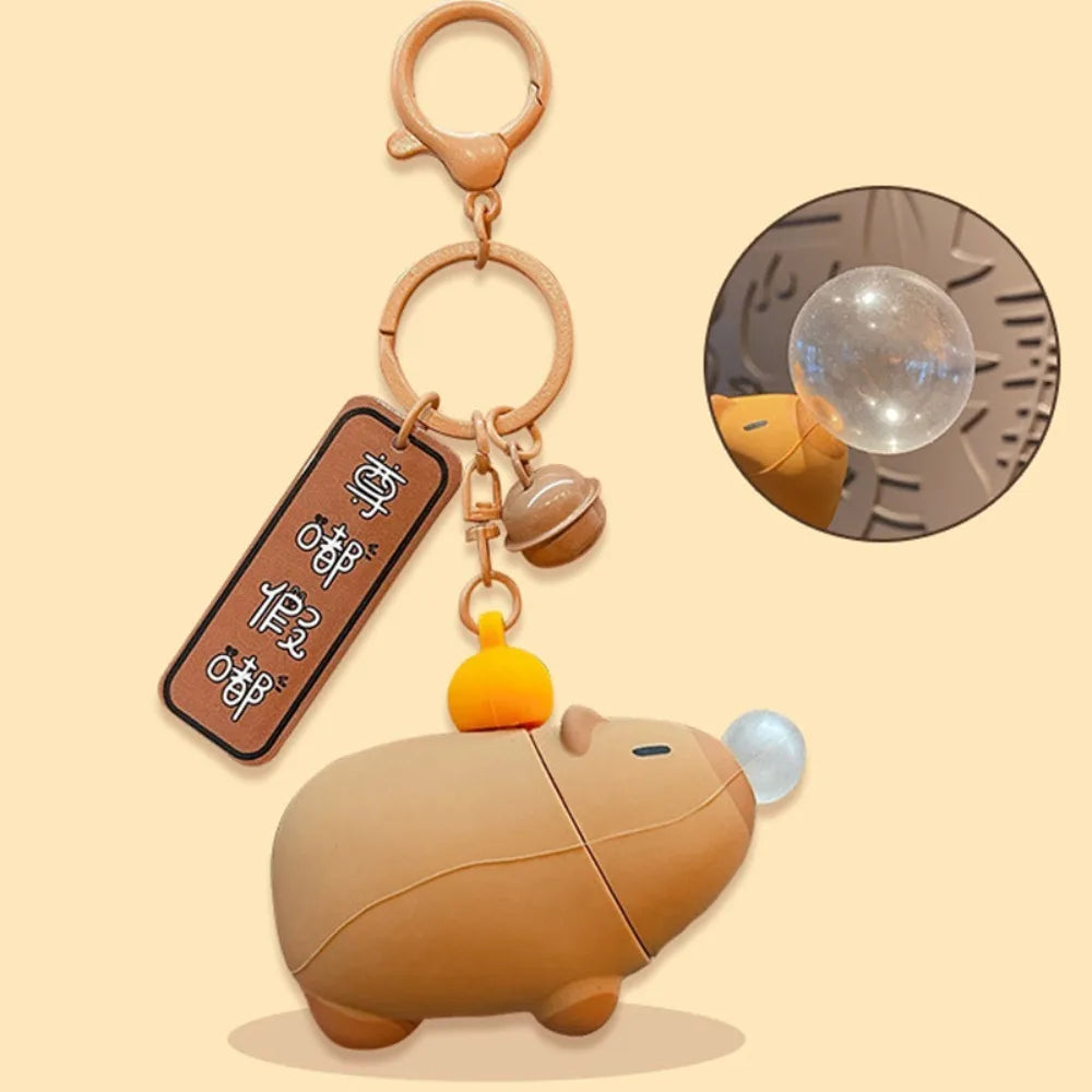 Capybara plush keychain with clear bubble feature, brown body and hanging strap