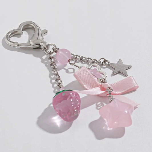 Pink acrylic keychain with bow, strawberry bead, heart clasp and star charms