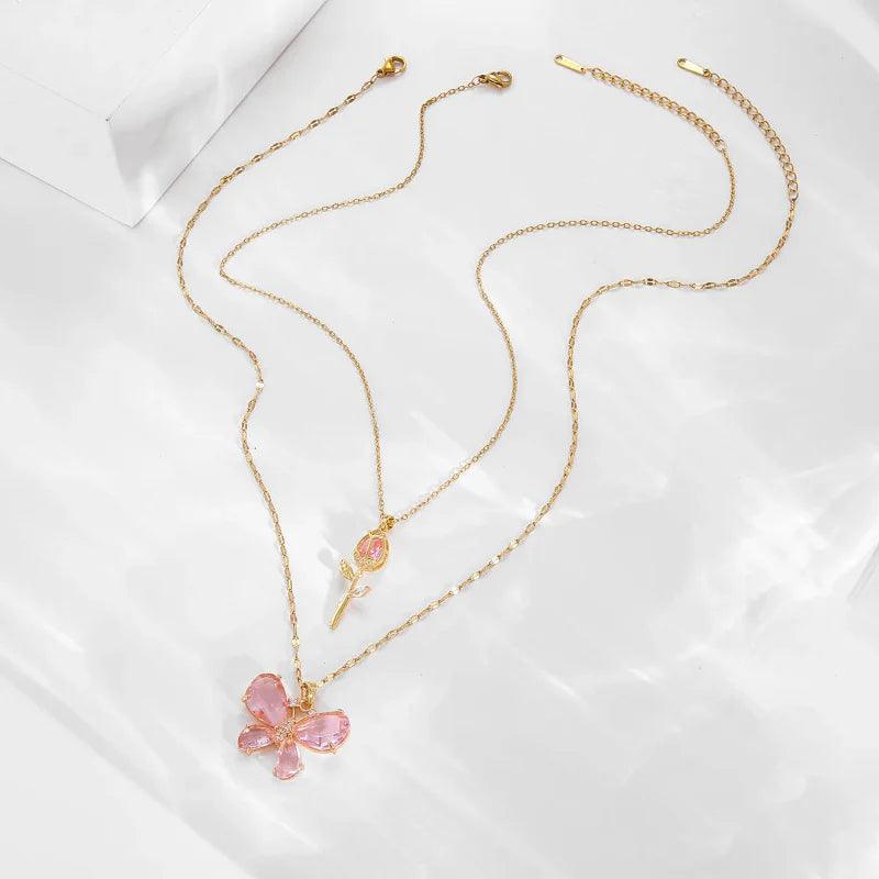 Gold-tone butterfly rose necklace with pink butterfly pendant on a delicate chain