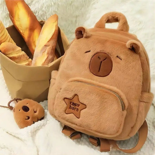 Tan capybara plush backpack with front zip pocket and small capybara keychain
