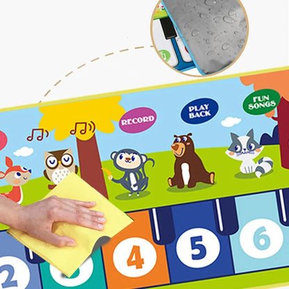 Close-up of colorful kids music mat showing record and play-back area and numbered keys