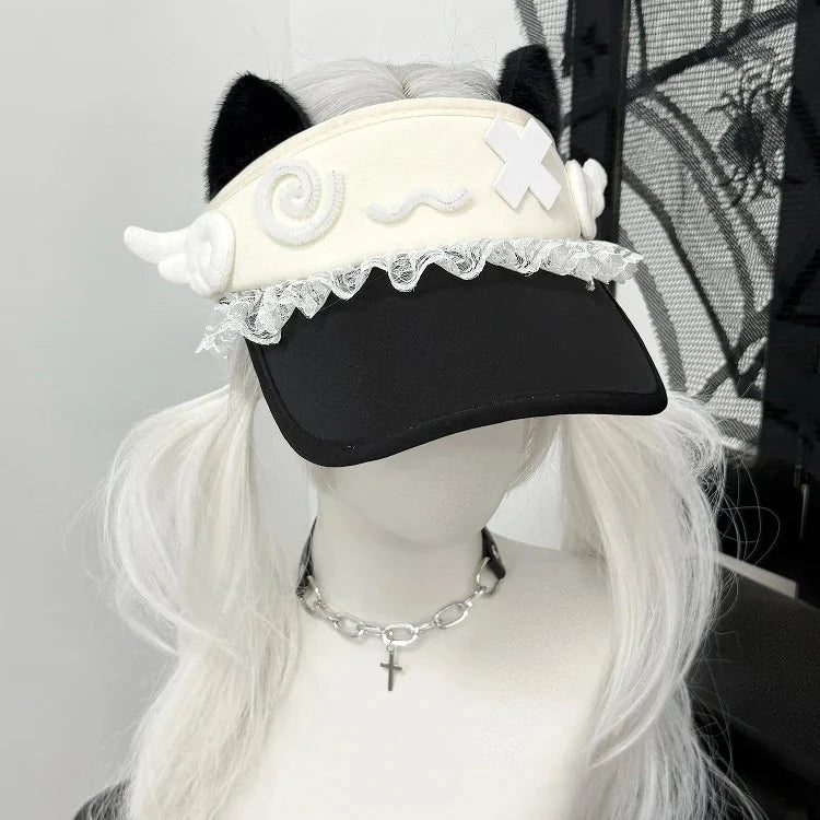 White cat-ear visor with lace trim and crossed patch over brim