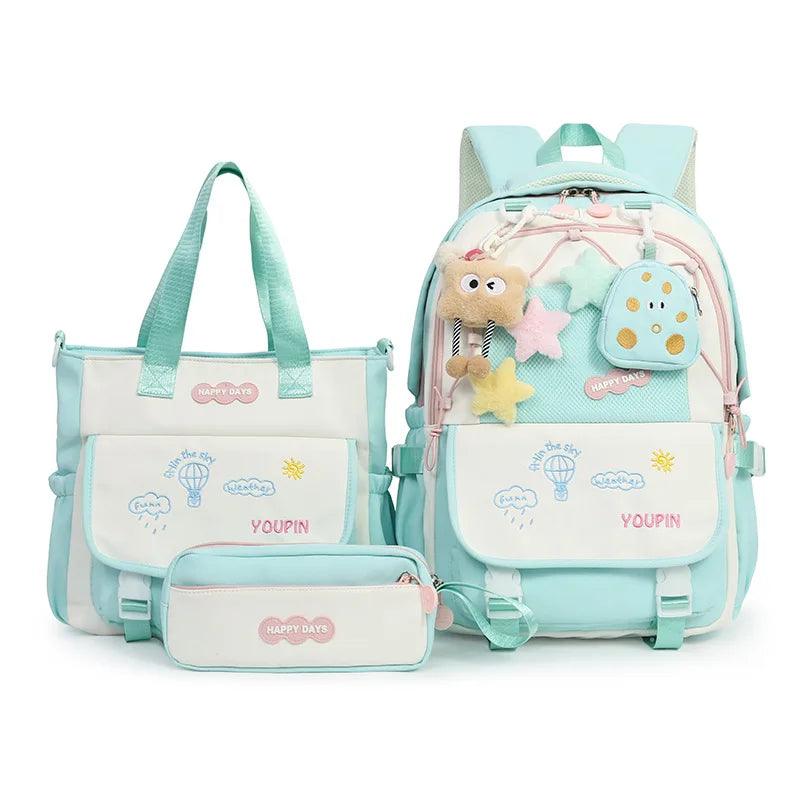 Teal kids backpack set with plush charm, front pocket, and matching small zip pouch