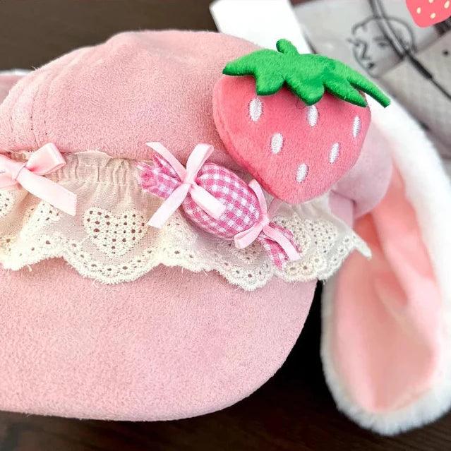 Close-up of Pink strawberry bunny hat: strawberry applique with lace trim and gingham ribbon bow