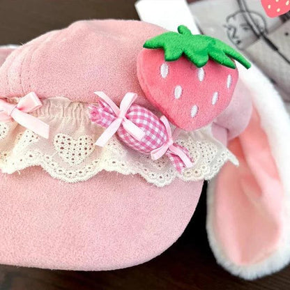 Close-up of Pink strawberry bunny hat: strawberry applique with lace trim and gingham ribbon bow