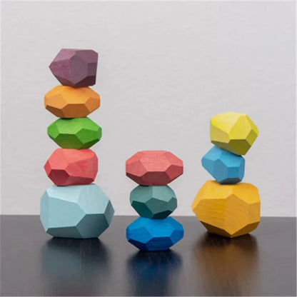 Wooden stacking rocks toy with low stacks of multicolor wooden pieces