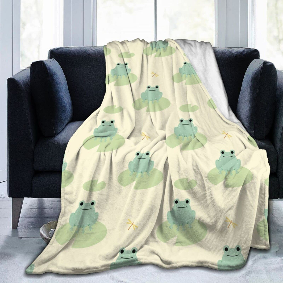 Flannel frog blanket in off-white with light green frogs and subtle sun motifs