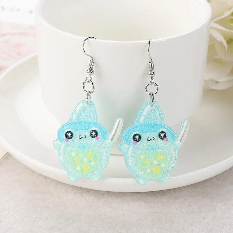 Frog acrylic earrings with light blue frog charms, heart accents, and silver hooks
