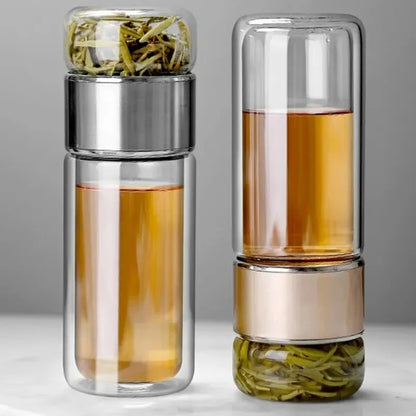 Clear double-compartment storage bottle with silver caps and dried items inside