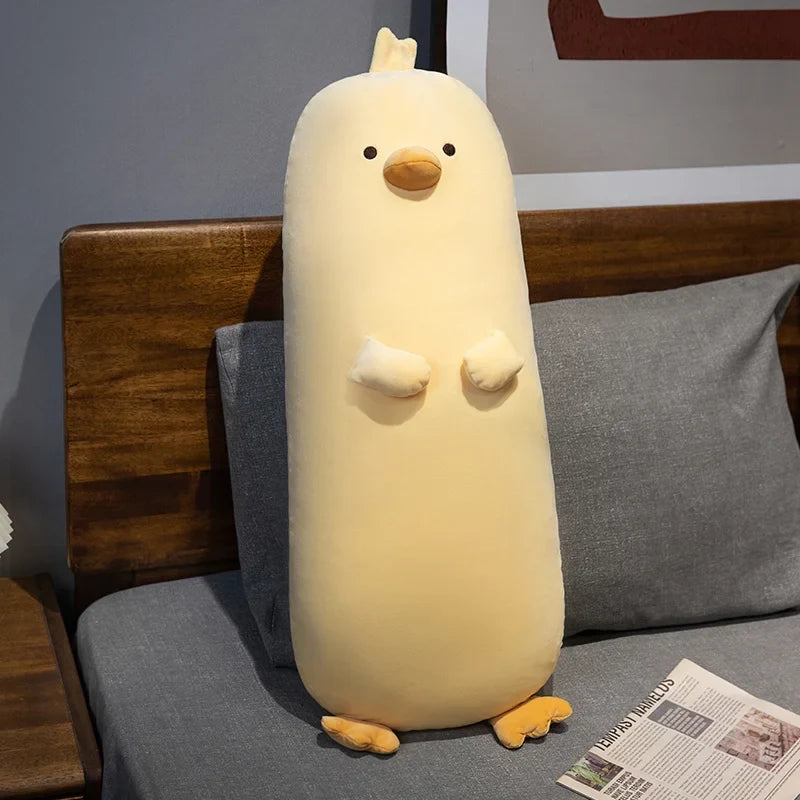 Long yellow chick plush pillow with embroidered beak, eyes, and soft feet