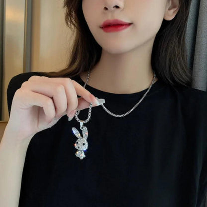 Rhinestone bunny pendant necklace worn on a neckline with small rabbit charm