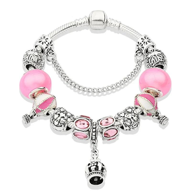 Pink charm bracelet with silver beads and pink stones; crown-heart drop charm