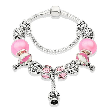 Pink charm bracelet with silver beads and pink stones; crown-heart drop charm