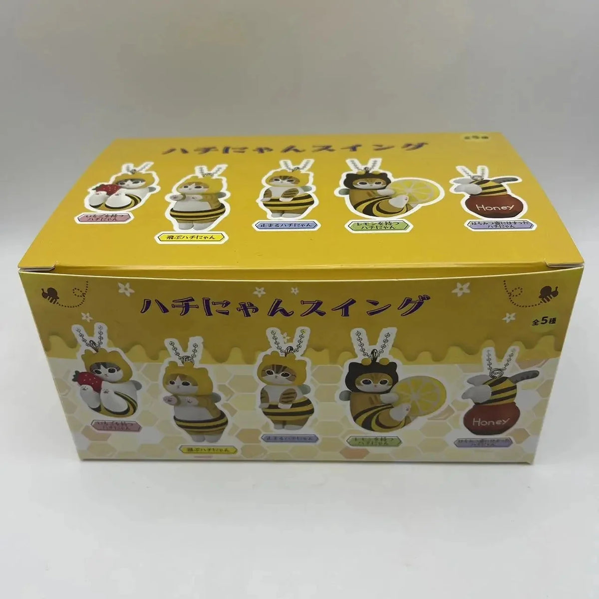 Yellow retail box for bee and cat twisted egg anime figure keychains, 5-pack