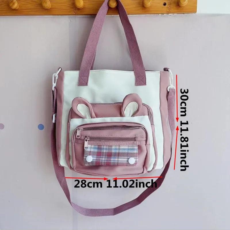 Pink bunny-ear tote shoulder bag with front plaid pocket and side compartments