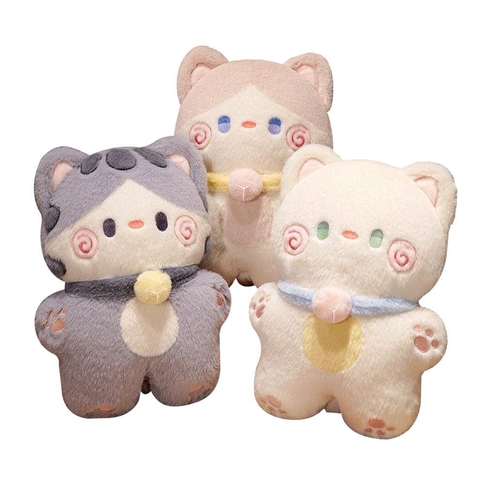 Set of three cat-shaped plush pillows in cream and grey with swirl faces