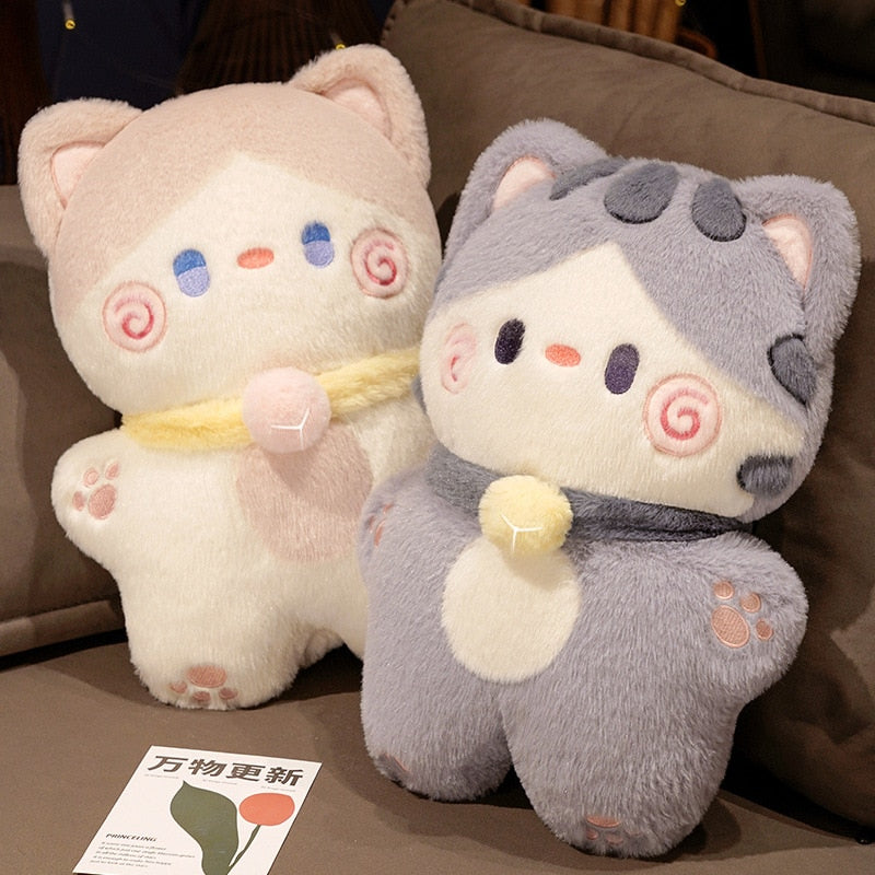 Pair of cat-shaped plush pillows: cream and grey with swirl faces and heart accents