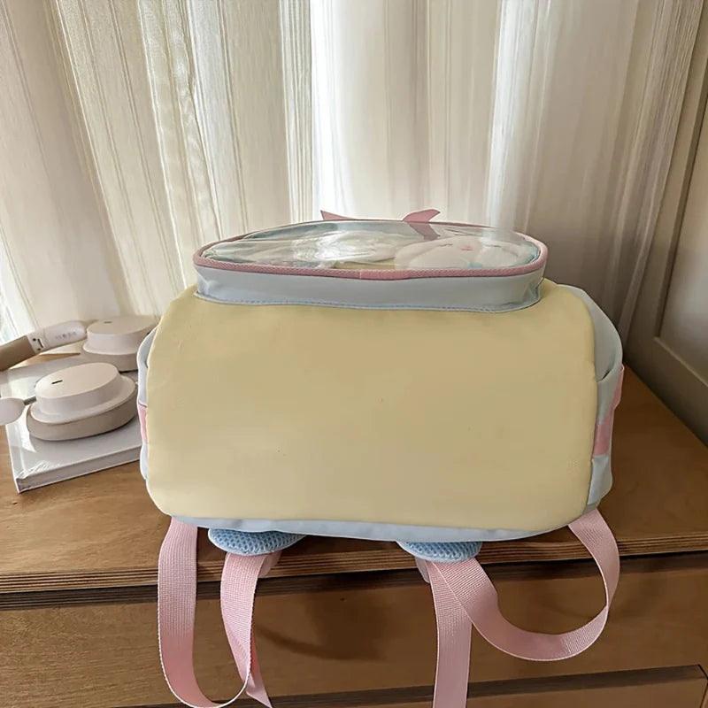 Pastel backpack base with front panel and pink-and-blue trim, set upright