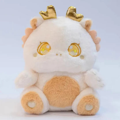 White baby dragon plush with gold star-eye embroidery and small brown heart paws