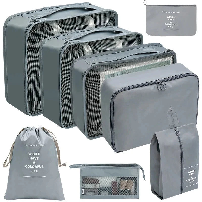 Dark gray packing cube set with gray mesh panels and zip pouches for travel