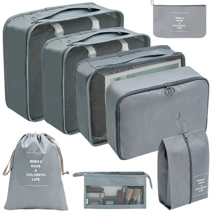 Dark gray packing cube set with gray mesh panels and zip pouches for travel