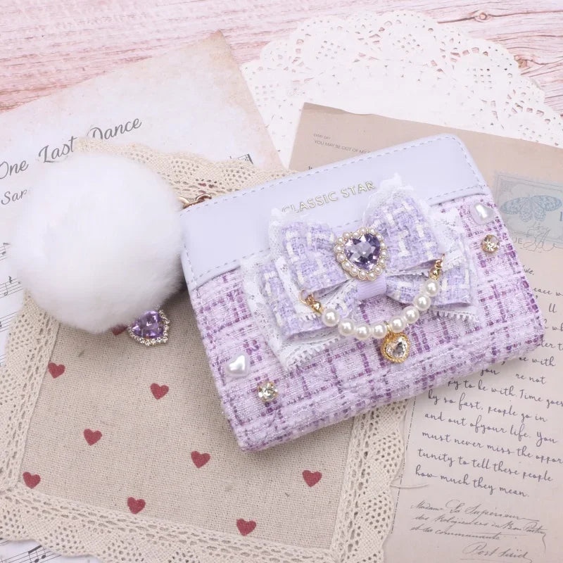 Lavender quilted wallet with bow and heart charms, pearl trim, and gold-tone zipper